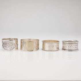 A Collection of Four Assorted Sterling Silver Napkin Rings