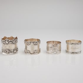 A Collection of Four Mixed Sterling Silver Napkin Rings