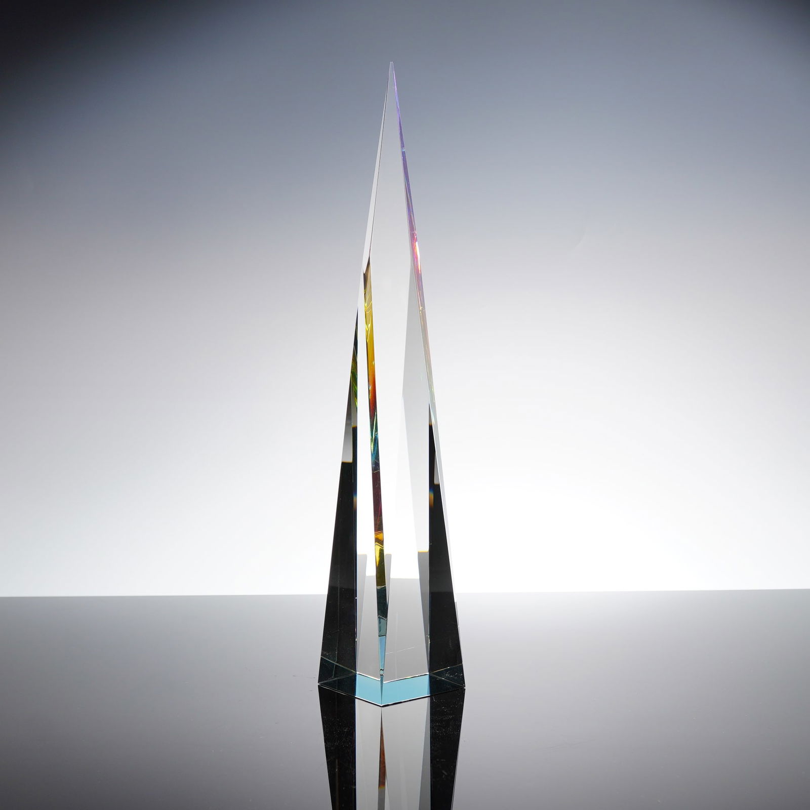 Crystal Obelisk Sculpture: Dichroic obelisk angled to the peak with square base. Dimensions: 2.50"L x 2.50"W x 14.00"H Weight: 3.2lbs