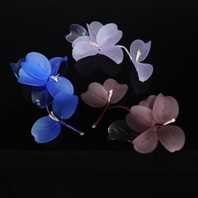 A Collection of Three Decorative Frosted Glass Floral Sprays