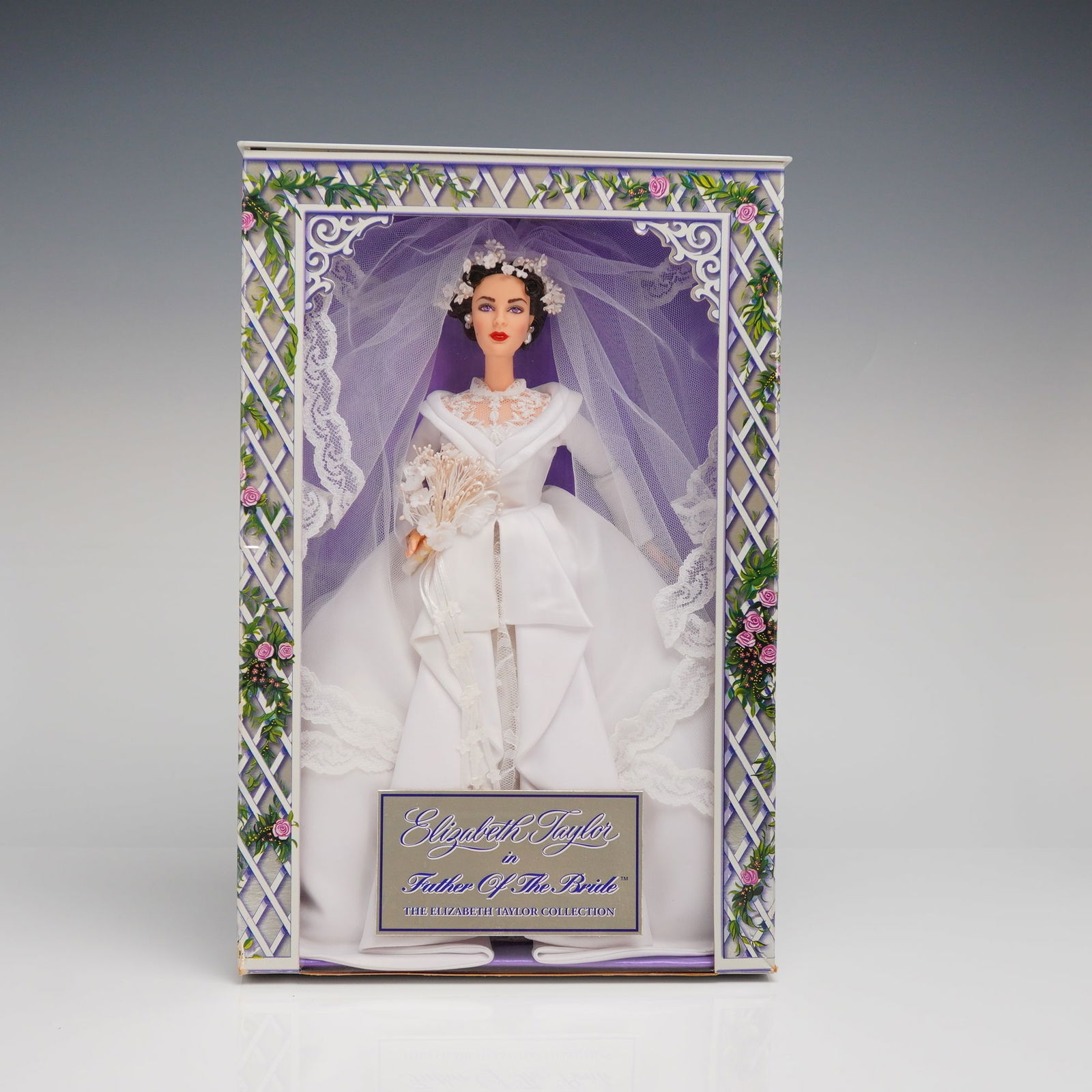 Mattel Elizabeth Taylor in Father of the Bride Barbie Doll: A collectible fashion doll identified as the Mattel Elizabeth Taylor in Father of the Bride Barbie Doll, stock number 26836, released circa 2000 as part of The Elizabeth Taylor Collection. The doll is