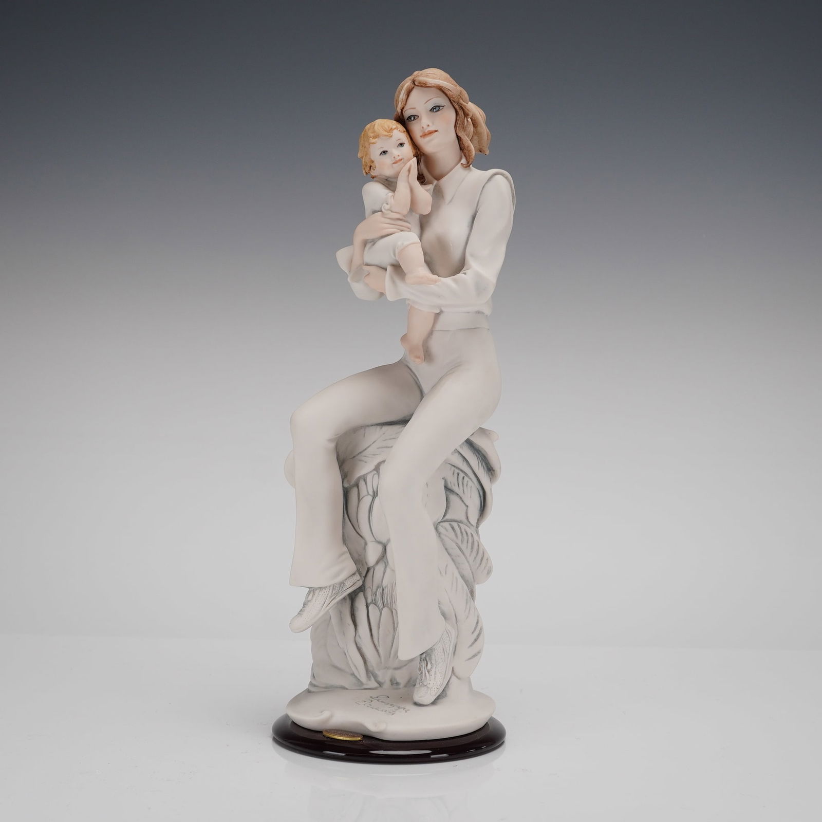Giuseppe Armani Florence Sculture dArte Figurine Easy to Love Model 1752F: A single figurine identified as "Easy to Love," Model 1752F, designed by Giuseppe Armani for Florence Sculture dArte. The piece is constructed of cold-cast resin or porcelain, depicting a seated young