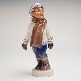 A Glazed Dahl Jensen Porcelain Figurine, Boy in Winter, No. 1064