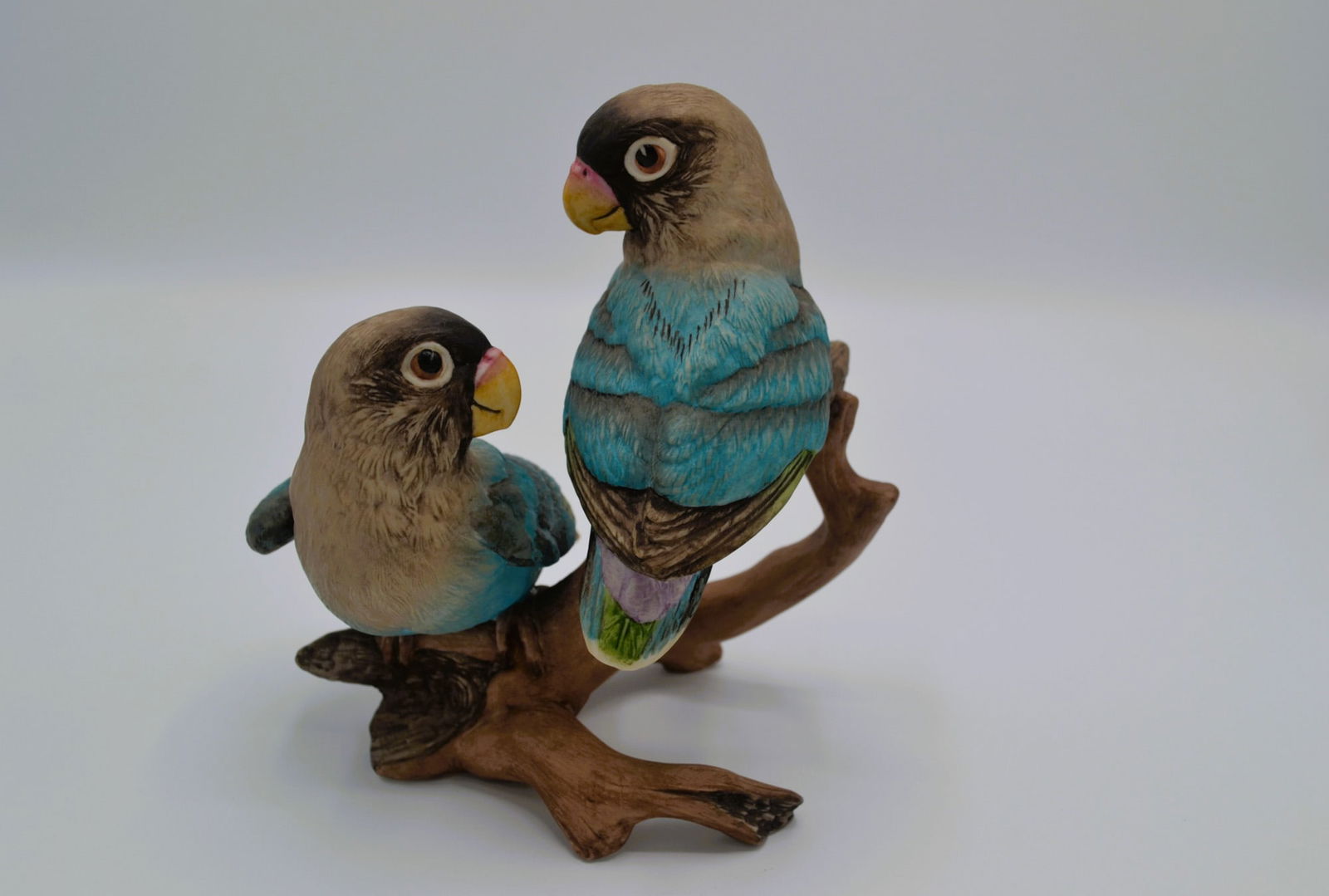 Boehm Porcelain Blue Masked Lovebirds Sculpture, 1976: Bisque Porcelain Decorated, hand created, hand painted by the Artists of the Boehm Studio. Hallmark: 400-58. Introduced in 1976, a sold out edition by 1979 . A favorite of most Bird Collectors, featur
