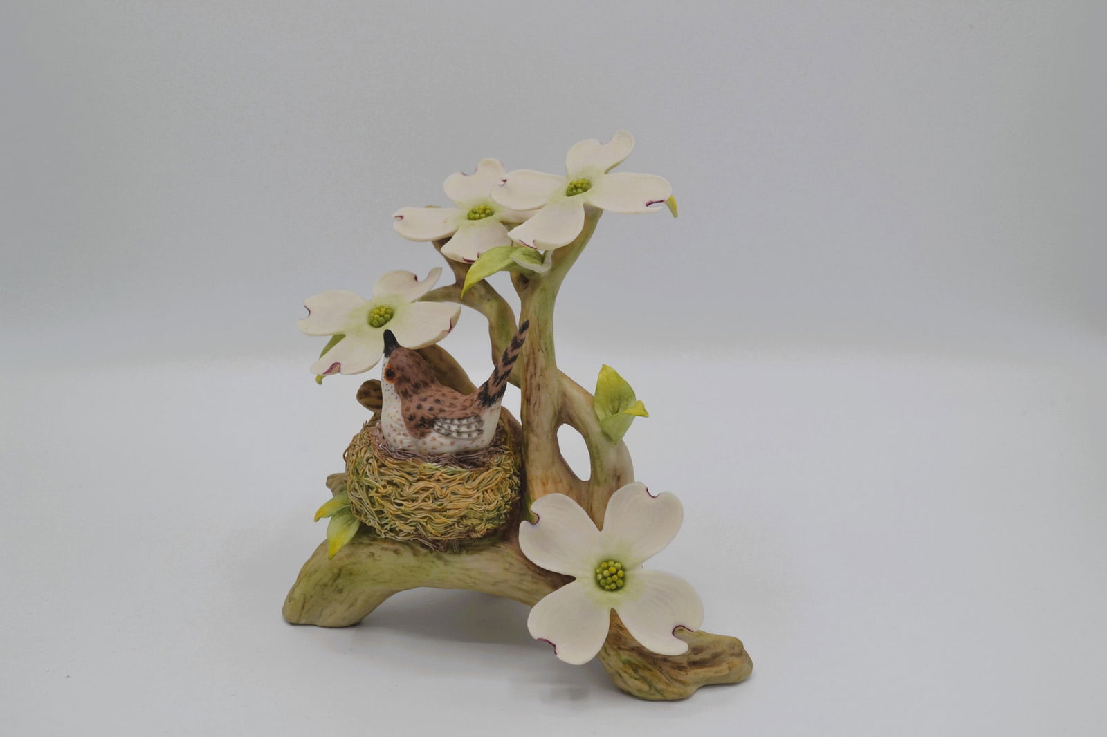 Cybis Porcelain Wood Wren With Dogwood, Sculpture, 1963: Bisque Porcelain Decorated, hand created, hand painted by the Artisans of the Cybis Studio. Featuring the Cybis Vintage Wood Wren with Dogwood in full color from The Birds and Flowers Collection. Hall