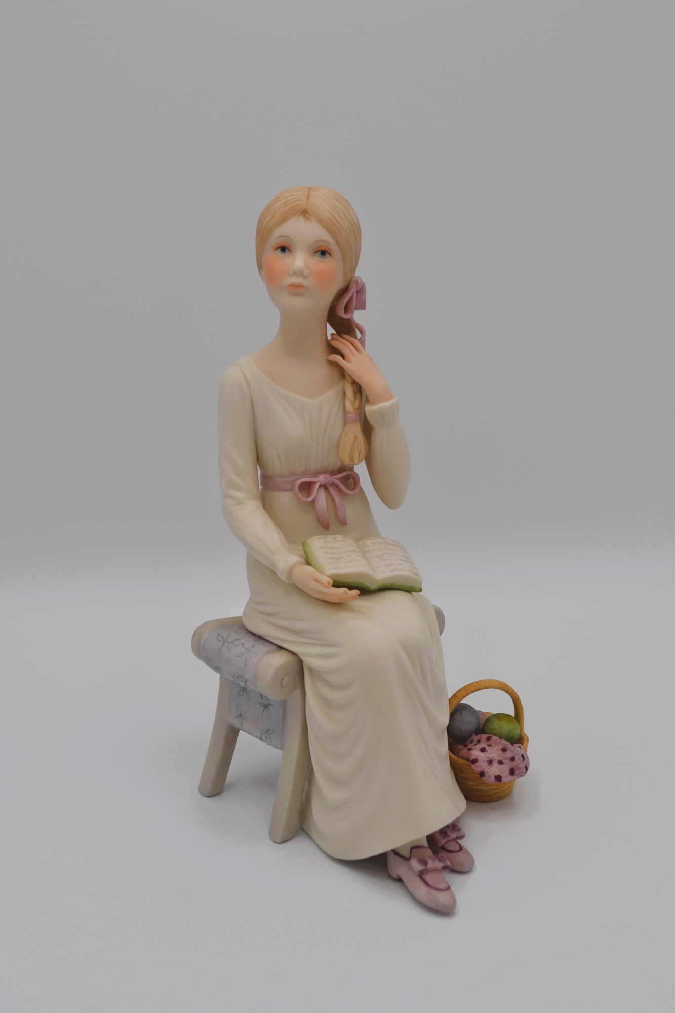 Cybis Porcelain Alice Seated Sculpture, 1978: Bisque Porcelain Decorated, hand created, hand painted by the Artisans of the Cybis Studios in Trenton, NJ, USA. Featuring Alice from the Childrens Hour Collection. Hallmark Design Number: 4006. Issue