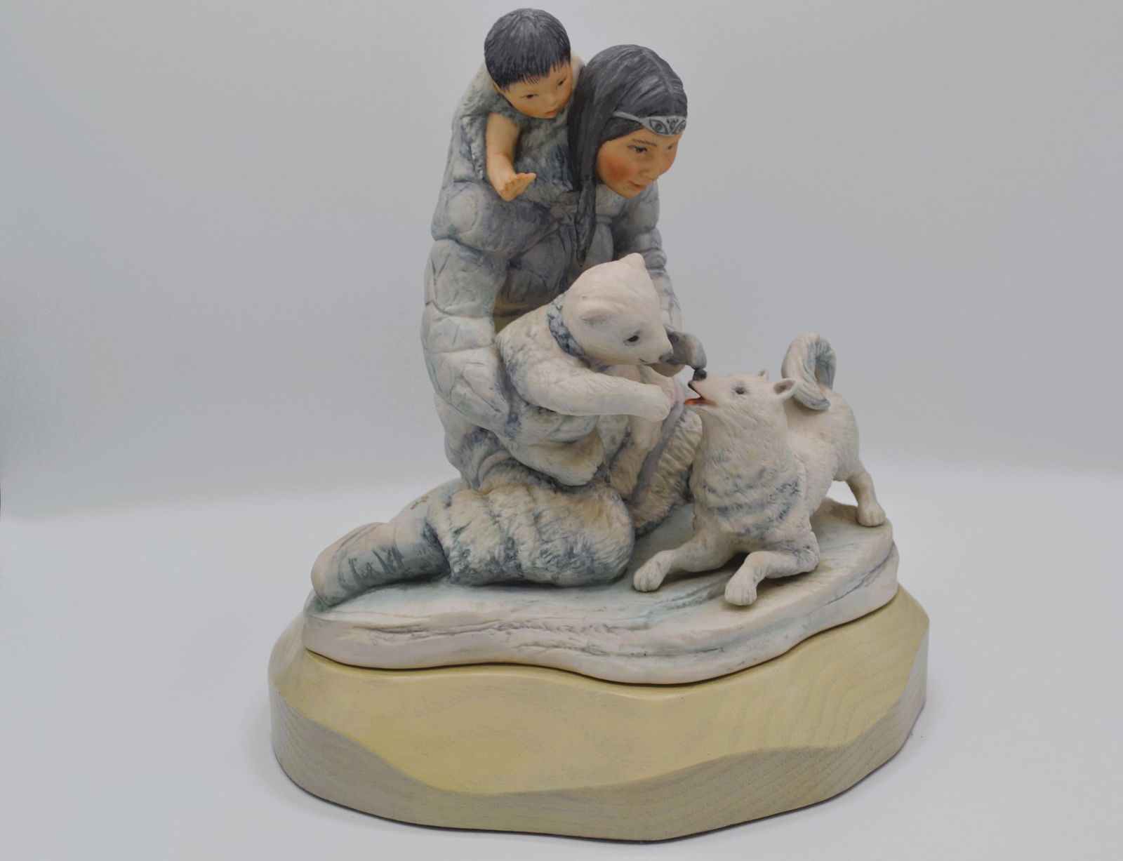 Cybis Porcelain Eskimo Mother Sculpture, 1973: Bisque Porcelain Decorated, hand created, hand painted by the Artisans of the Cybis Studio in Trenton, NJ, USA. Featuring the Sculpture of the Eskimo Mother from the North American Indians Series Coll