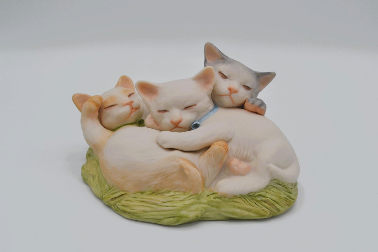 Cybis Porcelain Kittens, Taffy, Toffee And Tiger, 1982: Bisque Porcelain Decorated, hand created, hand painted by the Artisans of the Cybis Studio in Trenton, NJ, USA. Featuring the Kittens, Taffy, Toffee and Tiger, as Three Little Kittens all snuggling to