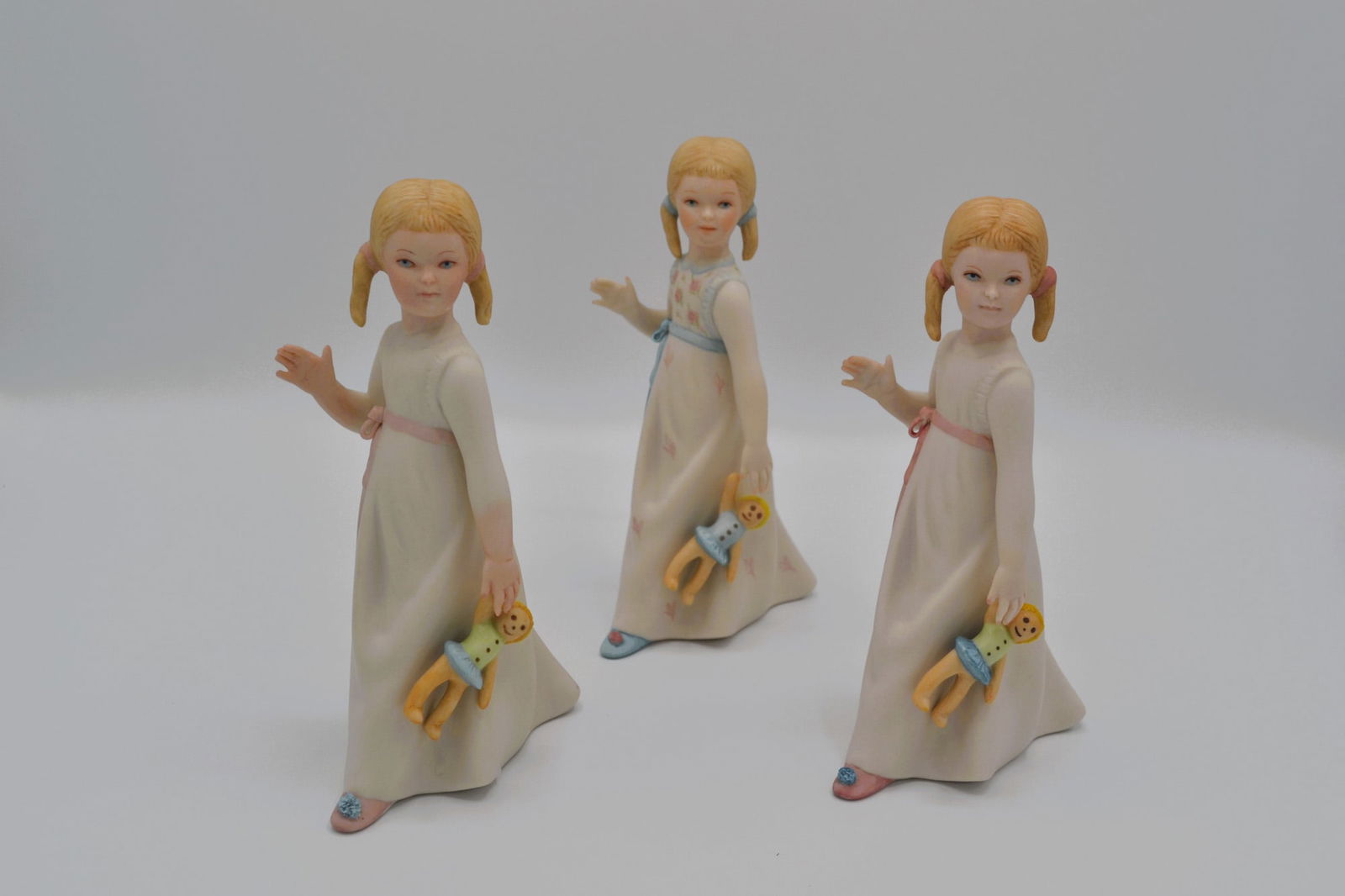3Pc Cybis Porcelain Wendy Sculptures, 1957: Bisque Porcelain Decorated, hand created, hand painted by the Artisans of the Cybis Studio in Trenton, NJ, USA. Featuring the three (3) different models of "Wendy" from the Children to Cherish Collect