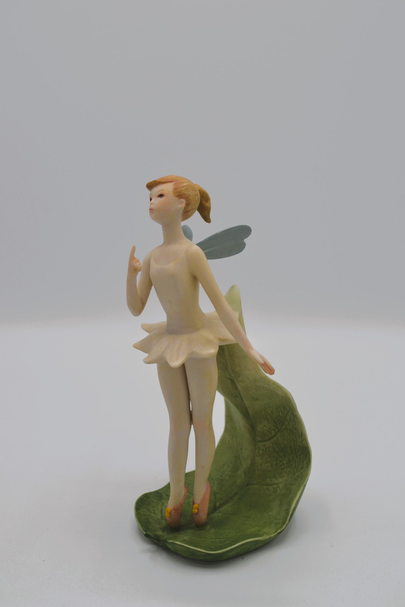 Cybis Porcelain Tinkerbell Sculpture, 1959: Bisque Porcelain Decorated, hand created, hand painted by the Artisans of the Cybis Studio in Trenton, NJ, USA. Featuring the Sculpture of "Tinkerbell" from the Children to Cherish Collection. Hallmar