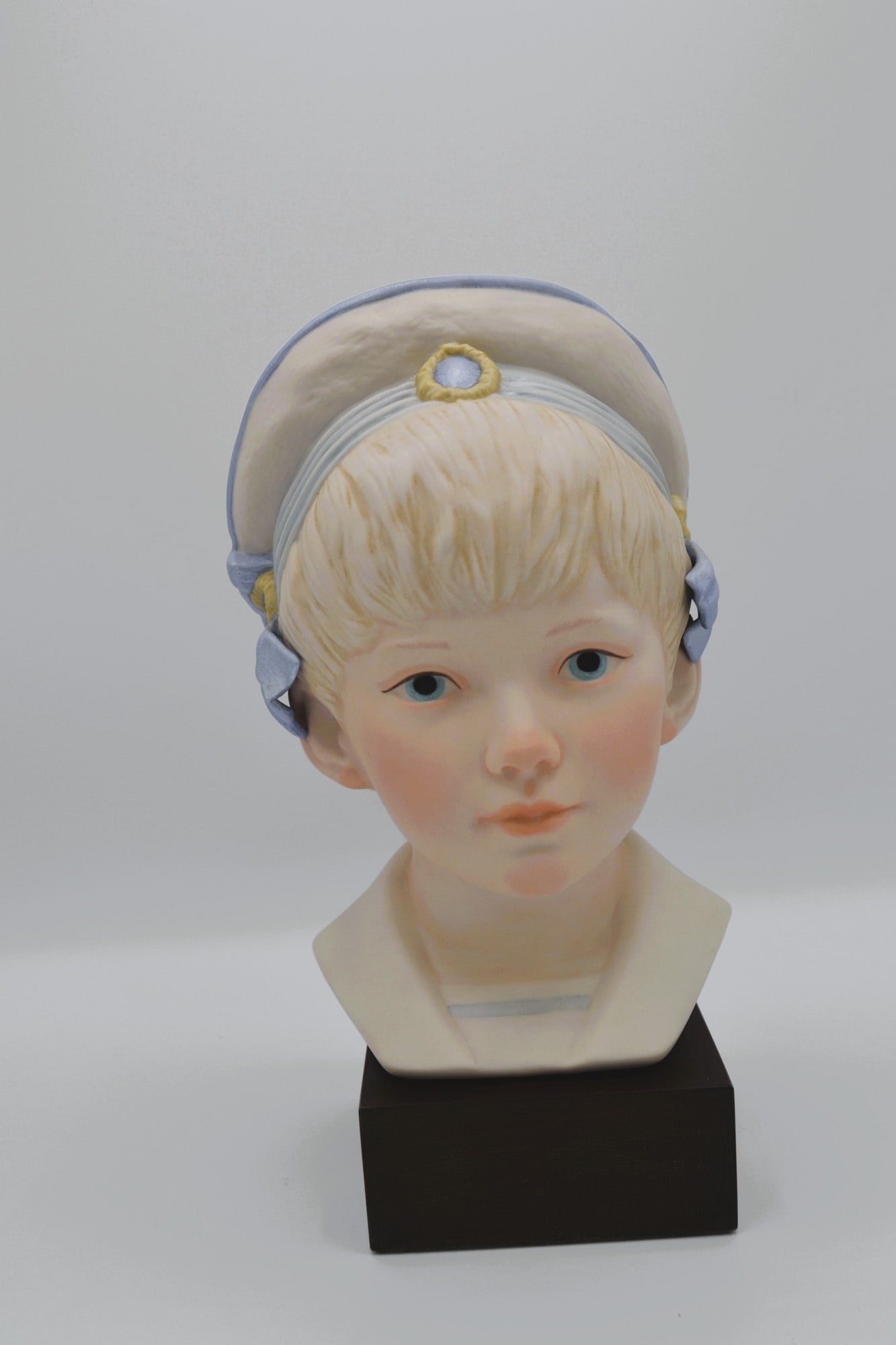 Cybis Porcelain Edward Bust Sculpture On Wood Base, 1981: Bisque Porcelain Decorated, hand created, hand painted by the Artisans of the Cybis Studio in Trenton, NJ, USA. Featuring the Head Bust Model of "Edward" from the Children to Cherish Collection. Hallm