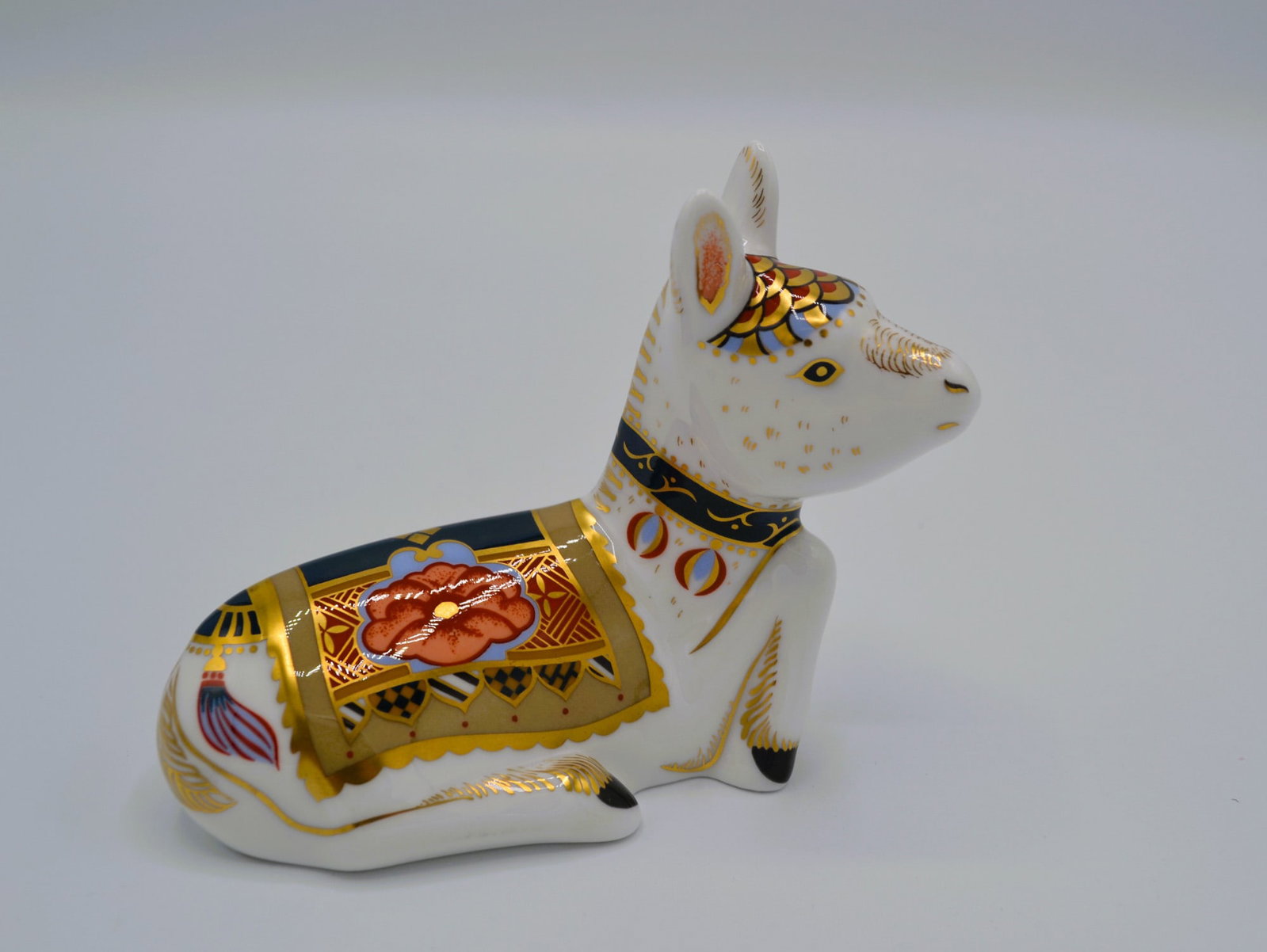 Royal Crown Derby Holly Donkey Foal Signature Edition Paperweight, 2002: English Fine Bone China, Glazed Decorated Holly Donkey Foal Signature Edition Paperweight. Hand made and hand painted by the Artists of the Royal Crown Derby Studios, individually free hand painted wi
