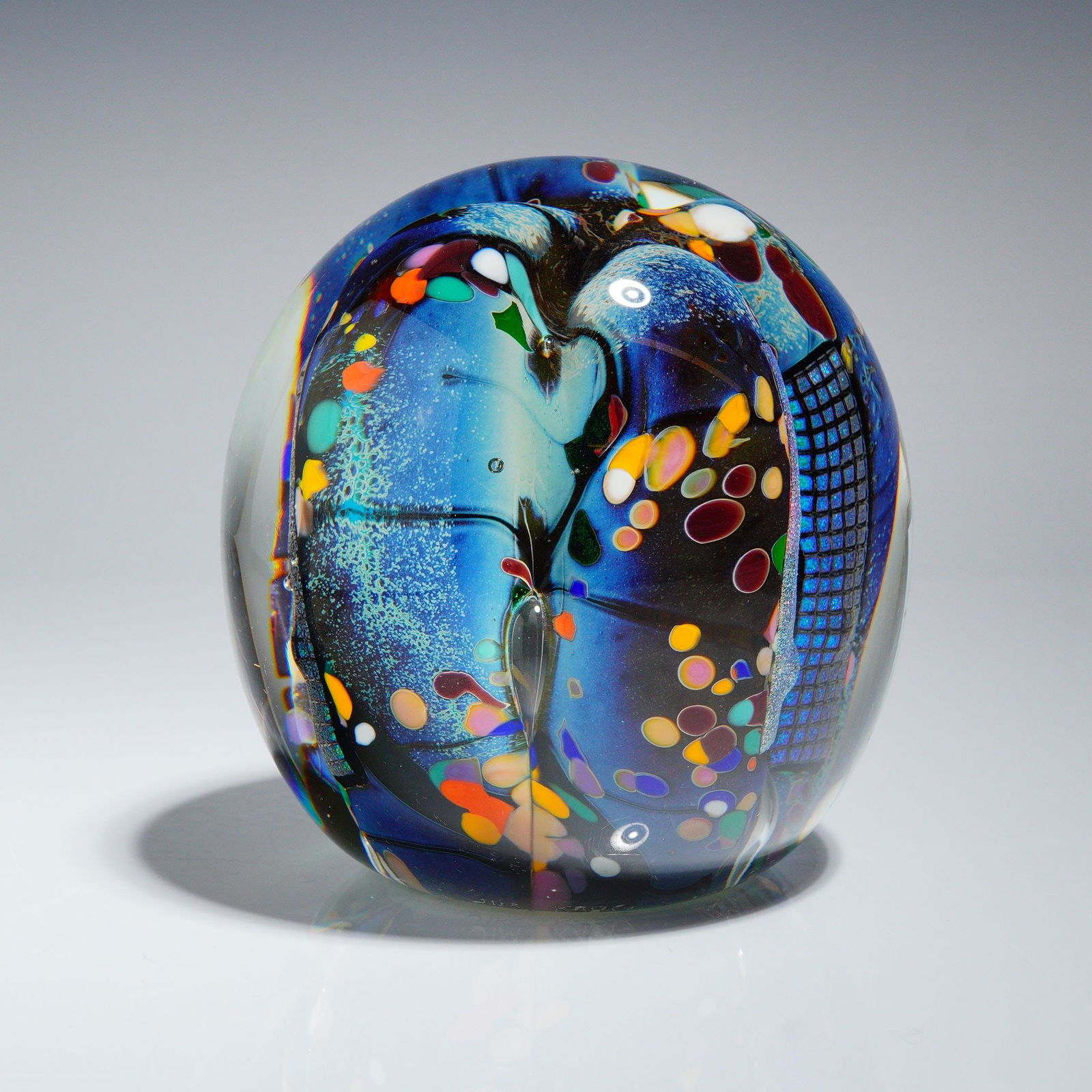 Jim Karg Studio Art Glass Sculpture, Cosmic Multicolor Ovoid Form Signed: A Jim Karg contemporary studio art glasswork sculpture executed in thick, clear glass encapsulating a complex internal abstract design. The composition features intense shades of cobalt and light blue