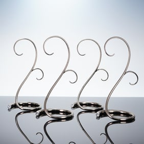 A Collection of Four Swarovski Ornament Display Stands