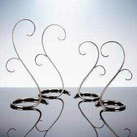 A Collection of Four Swarovski Ornament Display Stands