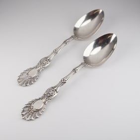 A Pair of Ornate Sterling Silver Serving Spoons, Patented 1896
