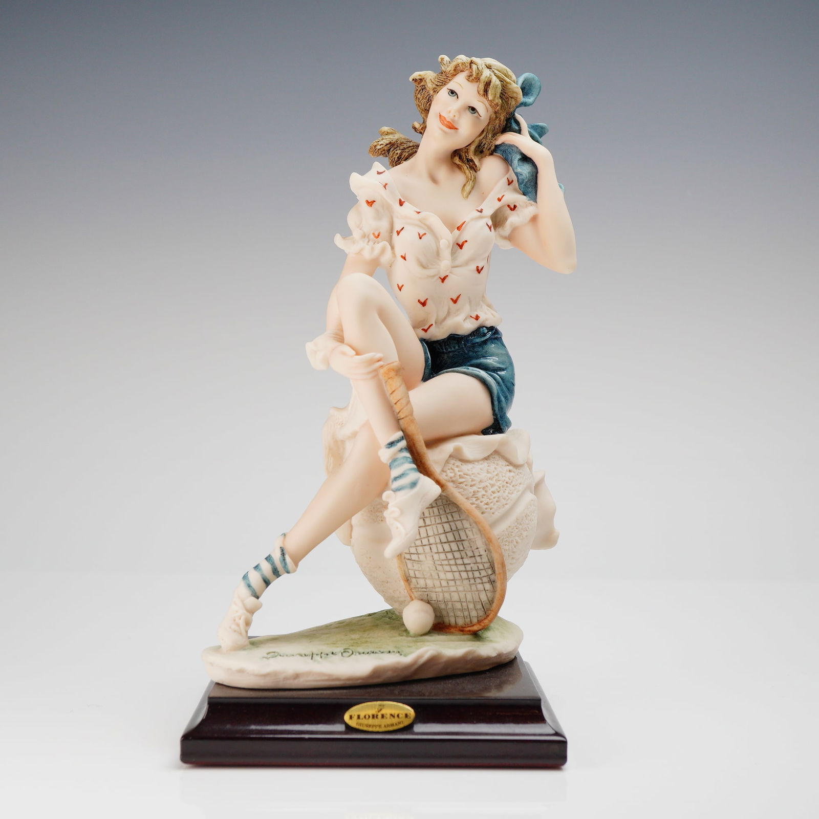 Giuseppe Armani Florence Figurine Tennis Star 1311C: A single figurative sculpture titled Tennis Star, model number 1311C, attributed to Giuseppe Armani for Florence (sculture d'arte, Made in Italy). The piece is crafted from painted composition materia