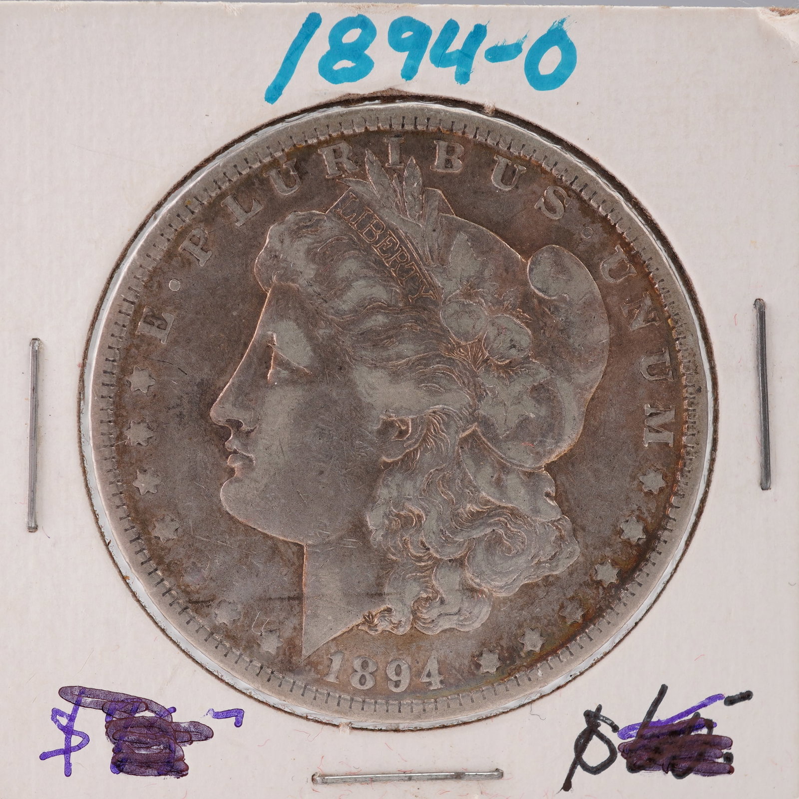 1894-O Morgan Silver Dollar: Struck at the New Orleans Mint. The obverse depicts a left-facing portrait of Liberty wearing a Phrygian cap adorned with wheat and cotton, with the inscription E PLURIBUS UNUM and the date 1894 below