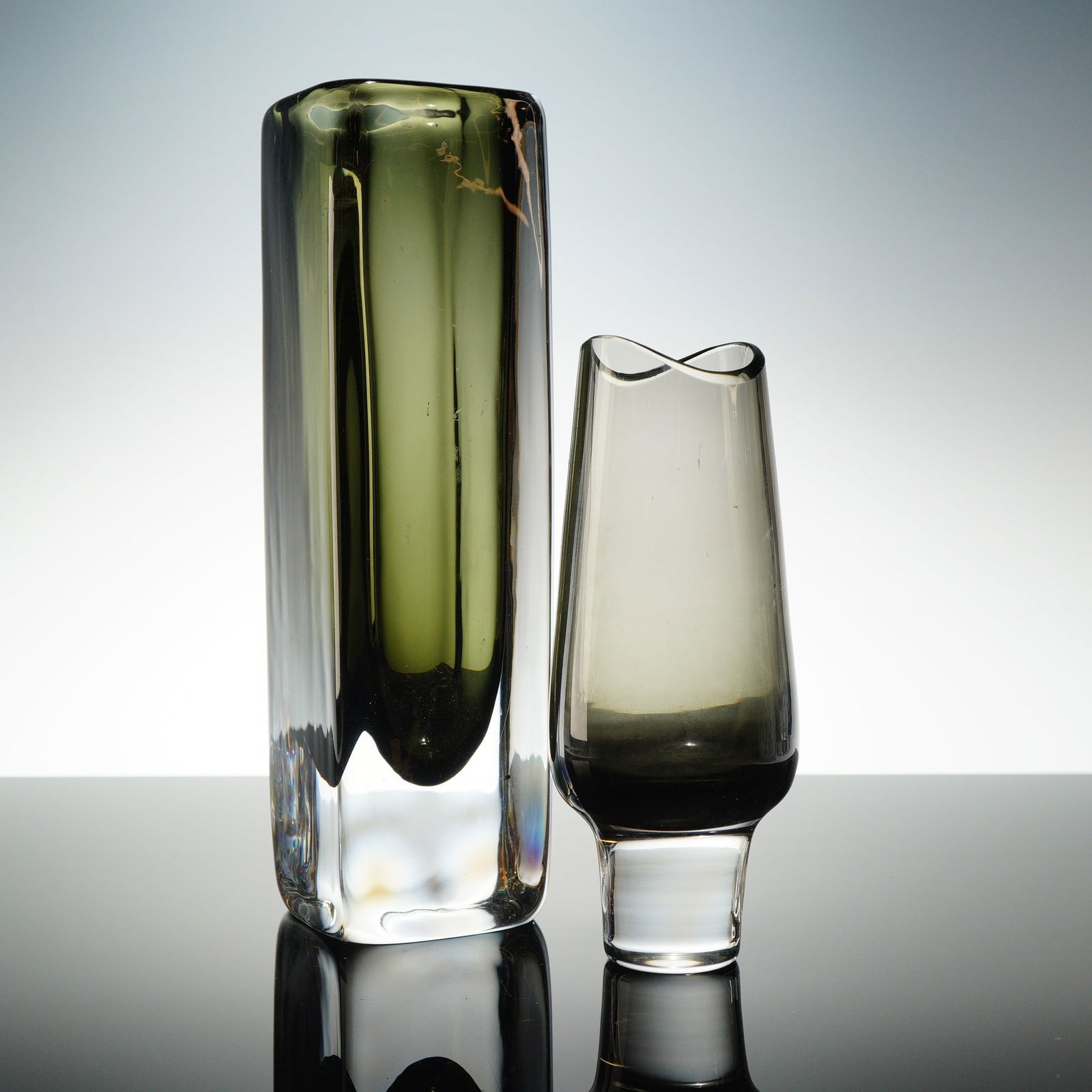 Two Nils Landberg Orrefors Sommerso Dusk Vases: This lot consists of two pieces of heavy Mid-Century Modern art glass designed by Nils Landberg for Orrefors, Sweden, consistent with the Sommerso 'Dusk' series. The primary item is a tall, rectangula