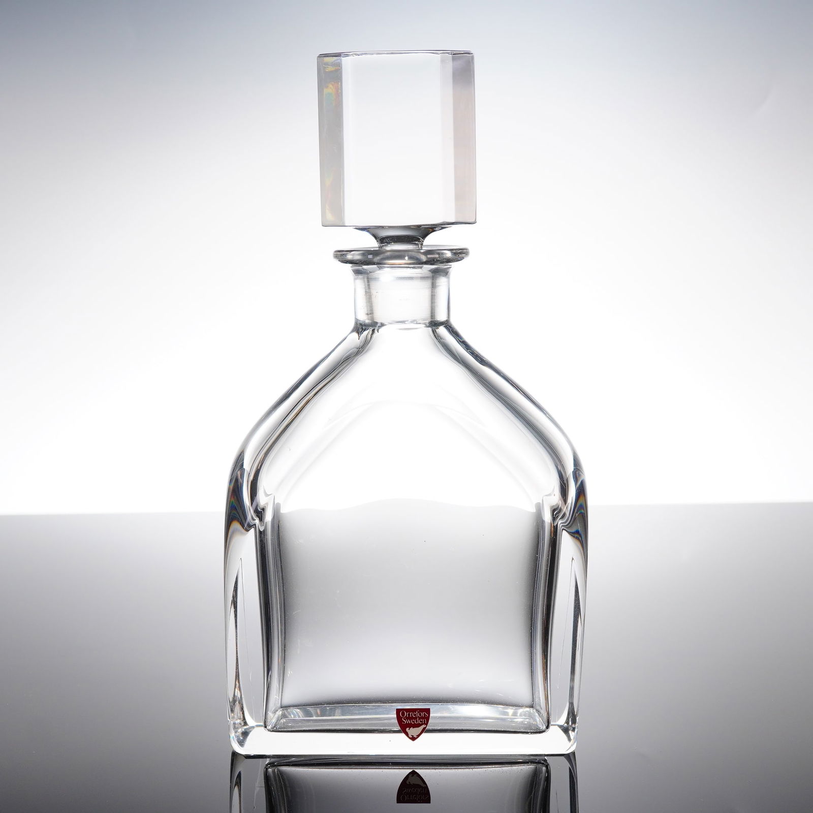 Orrefors Edward Hald Heavy Crystal Decanter and Stopper: A heavy crystal decanter and stopper, atributed to designer Edward Hald for Orrefors, Sweden. This decanter is suitable for spirits, such as whiskey, and is crafted from clear, heavy crystal. The body