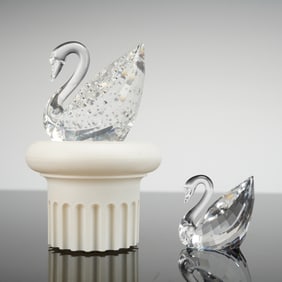 A Pair of Swarovski Crystal Centenary Swan Figurines with Stand