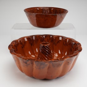 A Pair of Primitive Glazed Redware Turks Head Cake and Pudding Molds