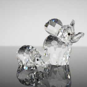 A Pair of Swarovski Faceted Crystal Elephant and Rhino Figurines