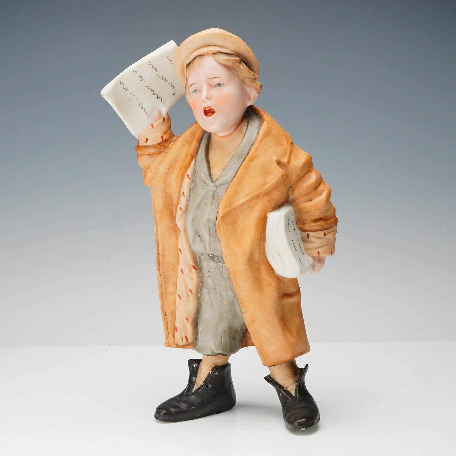 Himark Old World Original HEI Porcelain Newspaper Boy Figurine: This lively figurine features a bright and glossy mother frog with warm tones of orange, yellow, and black, captured in a relaxed pose. Perched playfully on her back is a smaller blue and green frog w