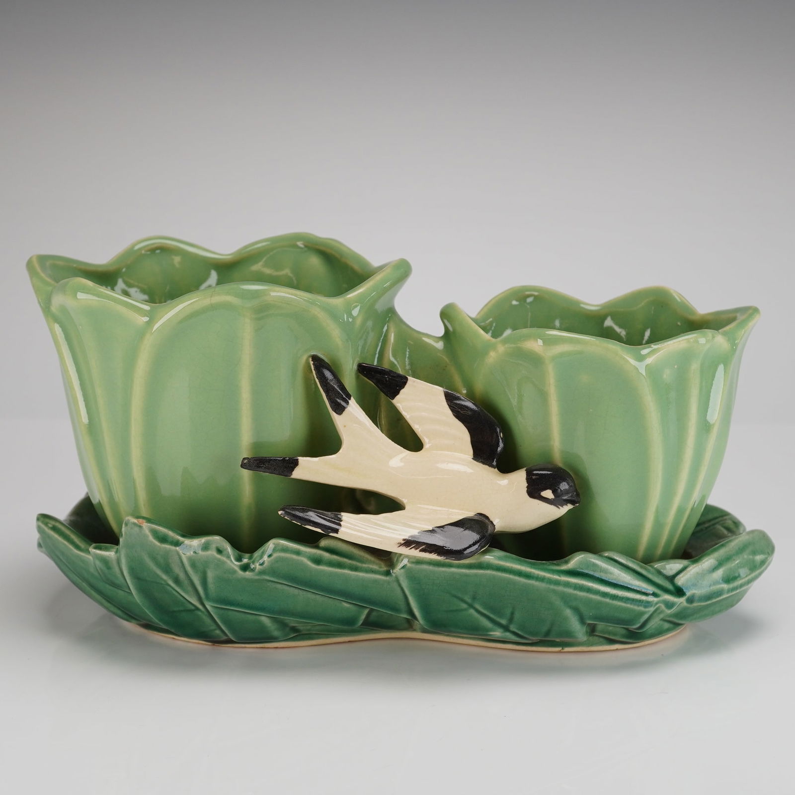 McCoy Pottery Double Tulip Swallow Planter: A vintage McCoy double planter, identified as the Double Tulip Swallow Planter pattern, dating to the mid-20th century (circa 1948-1949). The ceramic piece features two vertical planting pockets molde