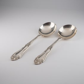 A Pair of Dunston Sterling Silver Rococo Revival Soup Spoons