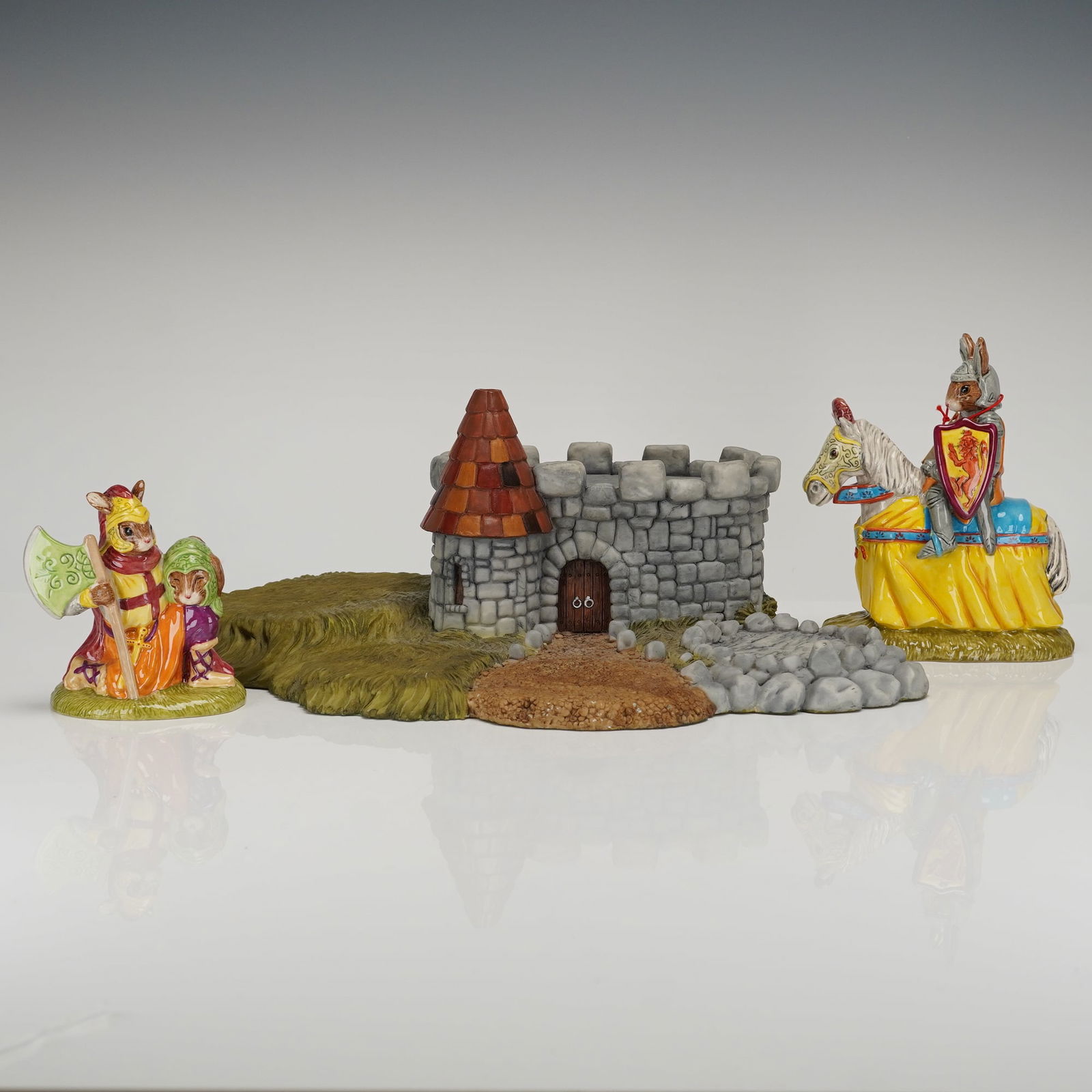 3 Royal Doulton Bunnykins Hedge Medieval Figurines & Scenic Base: A trio of hand-painted ceramic or resin figurines and scenic structures from the Border Fine Arts (BFA) Brambly Hedge Collection, based on the works of Jill Barklem. This 3pc lot features anthropomorp