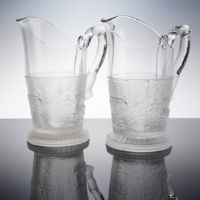A Pair of EAPG Westward Ho Frosted and Clear Glass Pitchers