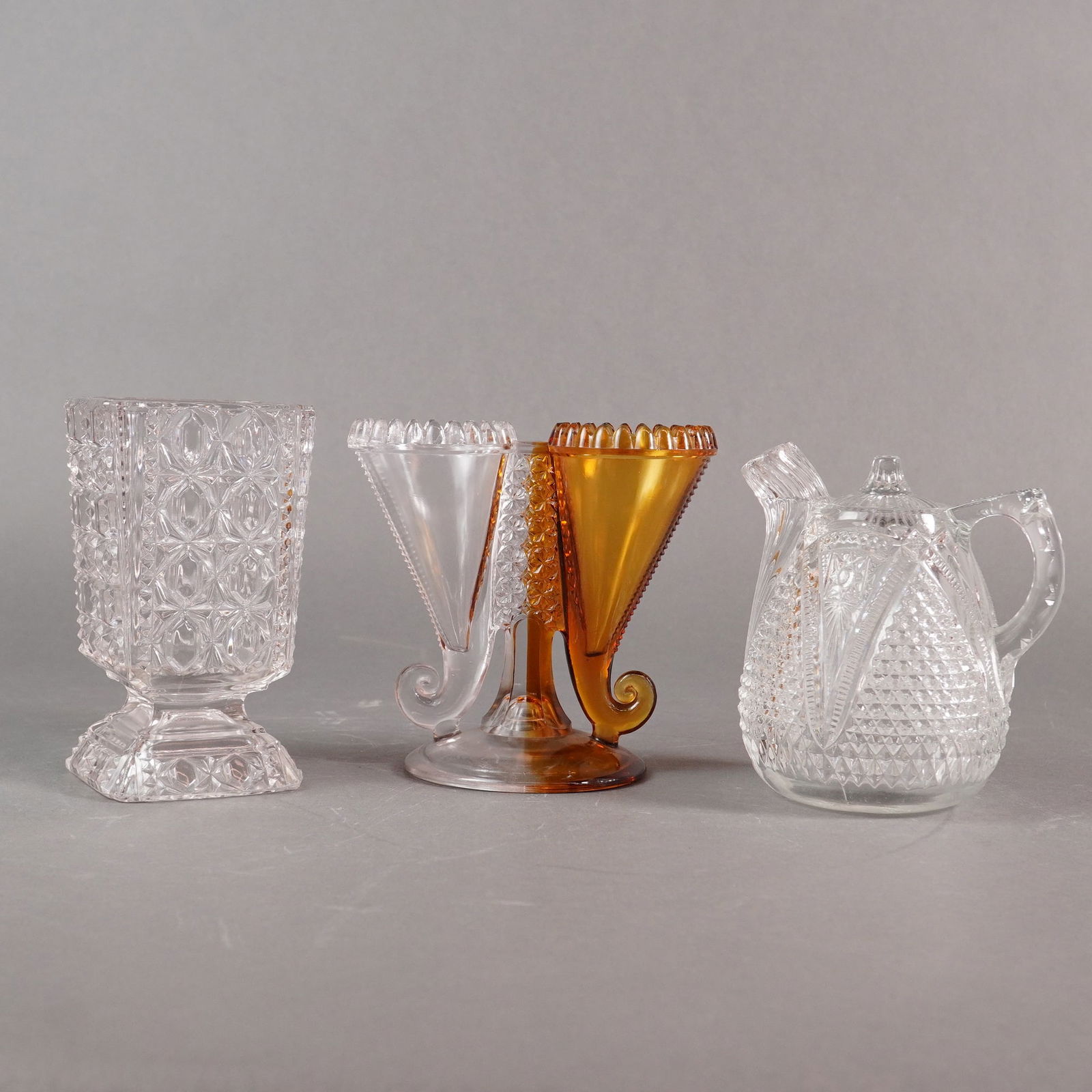 3pc American Pressed Glass EAPG Vases: A three-piece collection of Early American Pressed Glass (EAPG) items, consistent with late 19th to early 20th-century production. The lot includes three distinct molded and pressed glass forms. The f