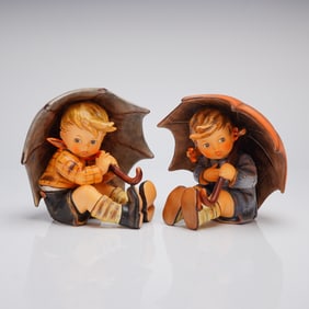 A Pair of M.I. Hummel Goebel Umbrella Boy and Umbrella Girl Figurines