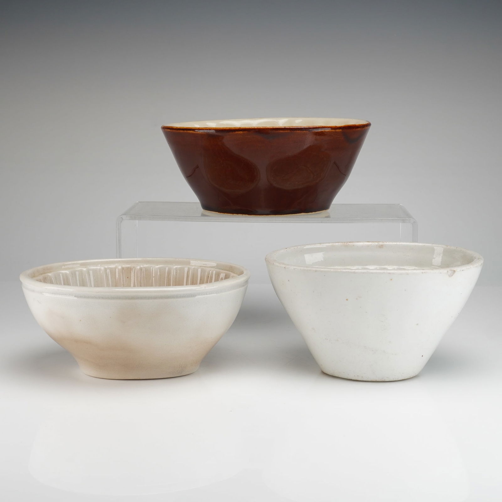 Three Piece Collection of 19th/20th Century Ceramic Baking and Jello Molds: A collection of three (3) pieces of glazed earthenware pottery, identified as utilitarian baking and jello molds and serving basins. This 3pc group is characteristic of English or American pottery pro