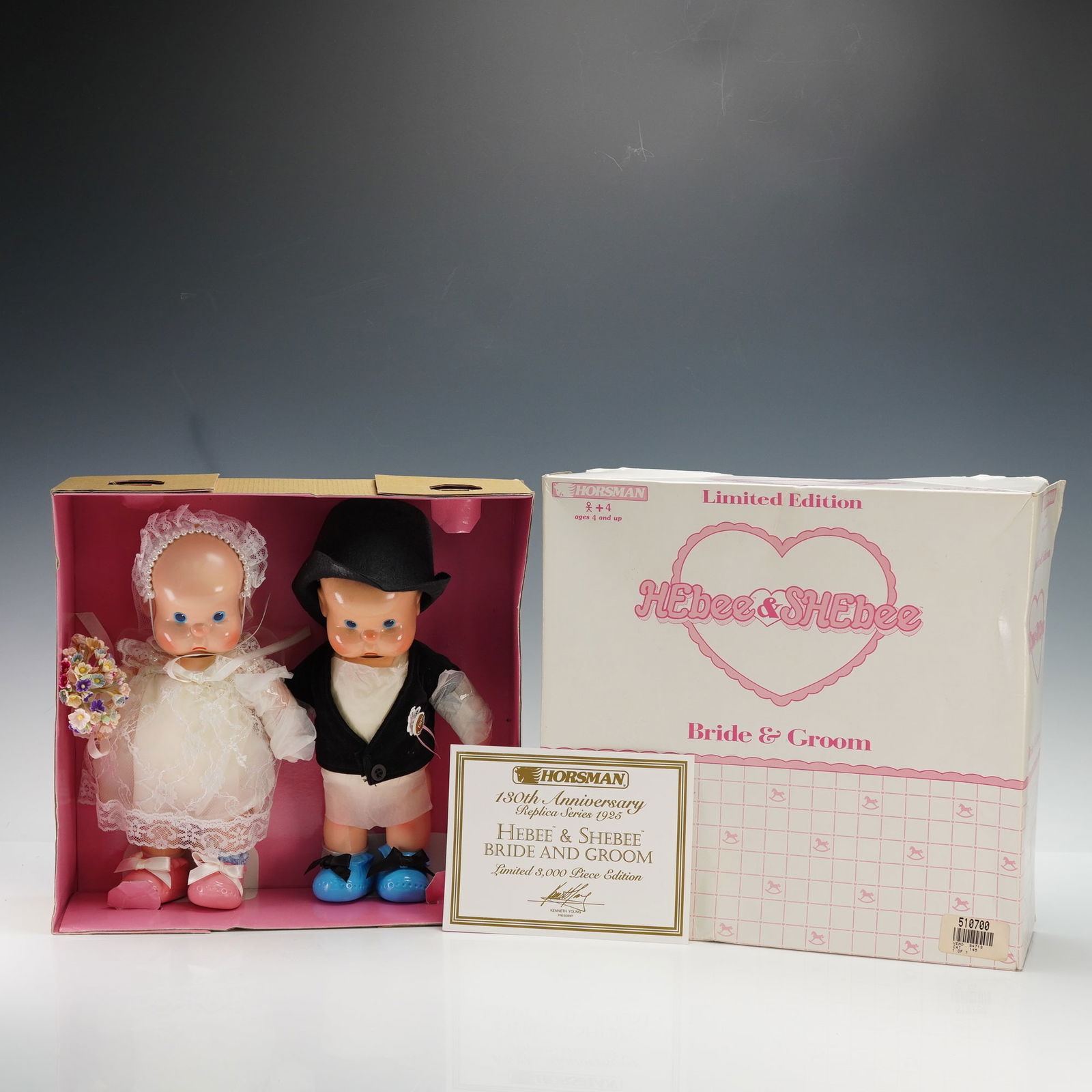 Pair of Horsman Hebee and Shebee Bride and Groom Dolls: Horsman 130th Anniversary Replica Series 1925 Hebee and Shebee Bride and Groom dolls. Limited 3,000 piece edition, with certificate of authenticity. Each dressed in wedding attire, the bride with lace