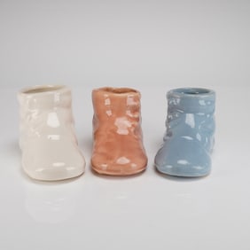 A Trio of McCoy Pottery Ceramic Baby Shoe Planters