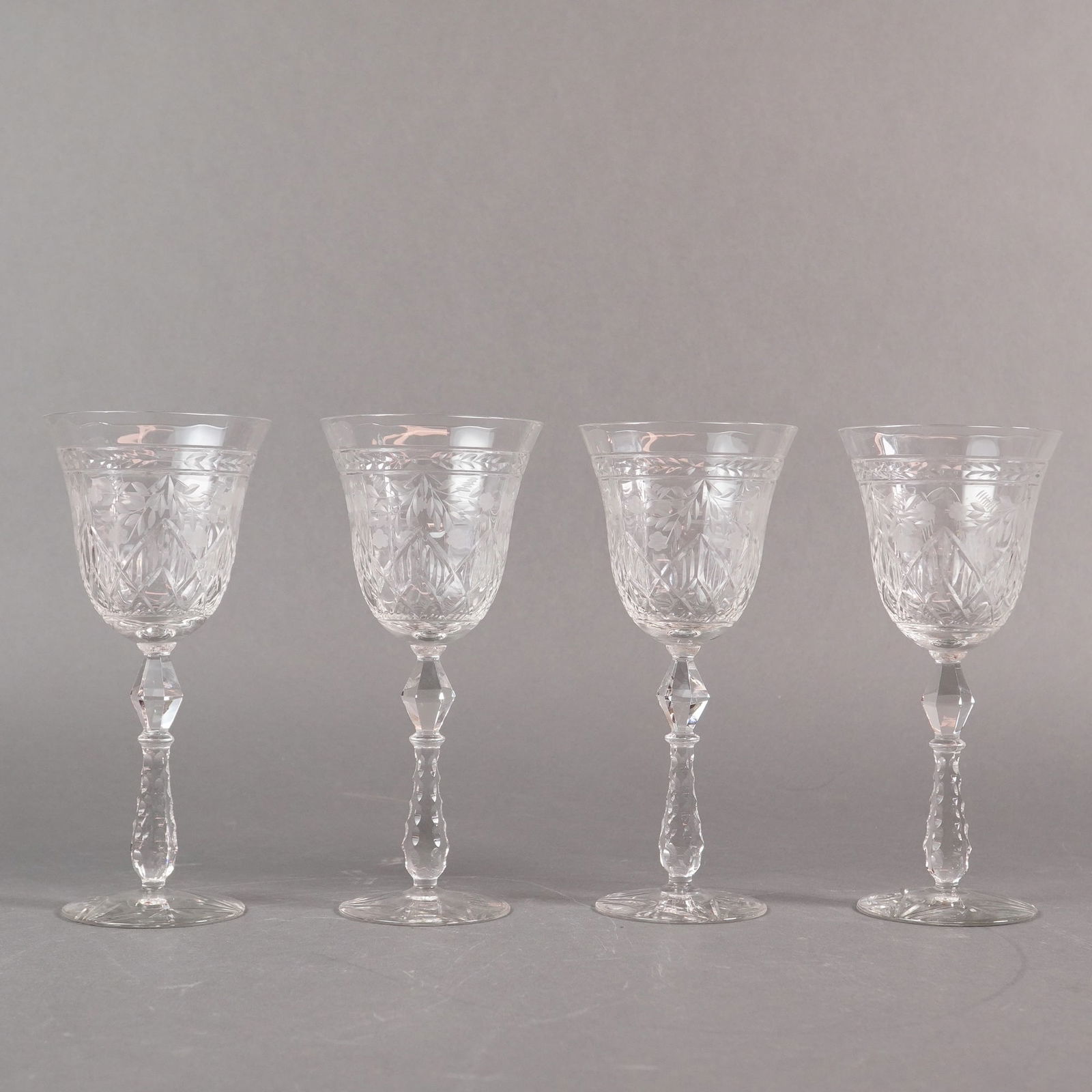A Set of Four Rock Sharpe Marina Crystal Water Goblets: A set of four (4) Rock Sharpe cut crystal water goblets in the Marina pattern. These stemmed drinking glasses are crafted from clear cut crystal or high-quality leaded glass. Each goblet features a de