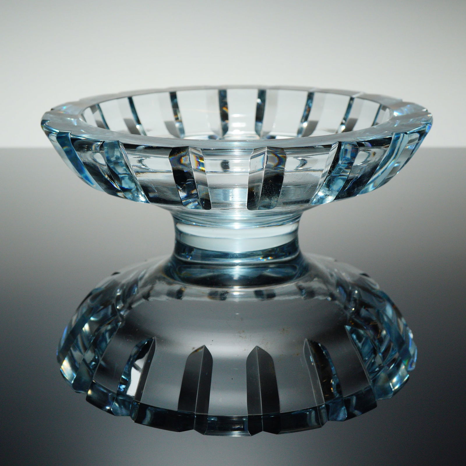 Orrefors by Edvin Ohrstrom Crystal Compote Bowl: A single Mid-Century Modern crystal compote bowl by Orrefors. The bowl is constructed of heavy, light aqua-blue tinted cut crystal, featuring deep, precise vertical geometric fi?uting applied consiste