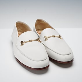 A Pair of Sam Edelman Loraine Bit White Leather Loafers