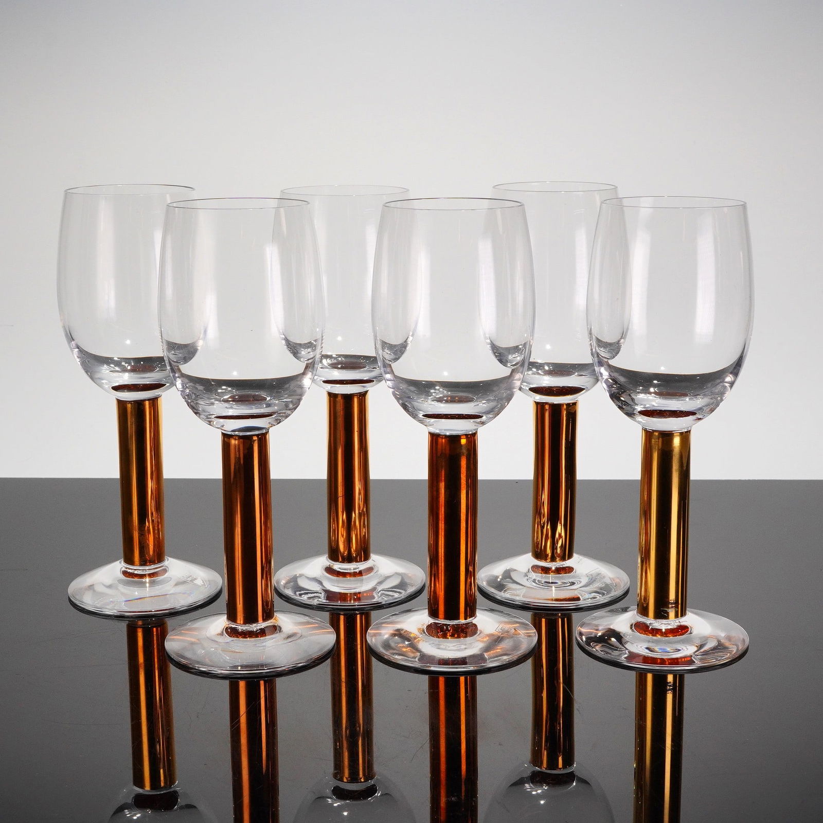 6pc Orrefors by Gunnar Cyren Nobel Wine Glasses: A collection of six (6) modern Swedish stemware wine glasses, model "Nobel," designed by Gunnar Cyren for Orrefors, Sweden, with the design dating to 1990-91. The 6pc set is composed of clear colorles