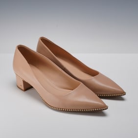 A Pair of Coach Willa Nude Leather Block-Heel Pumps