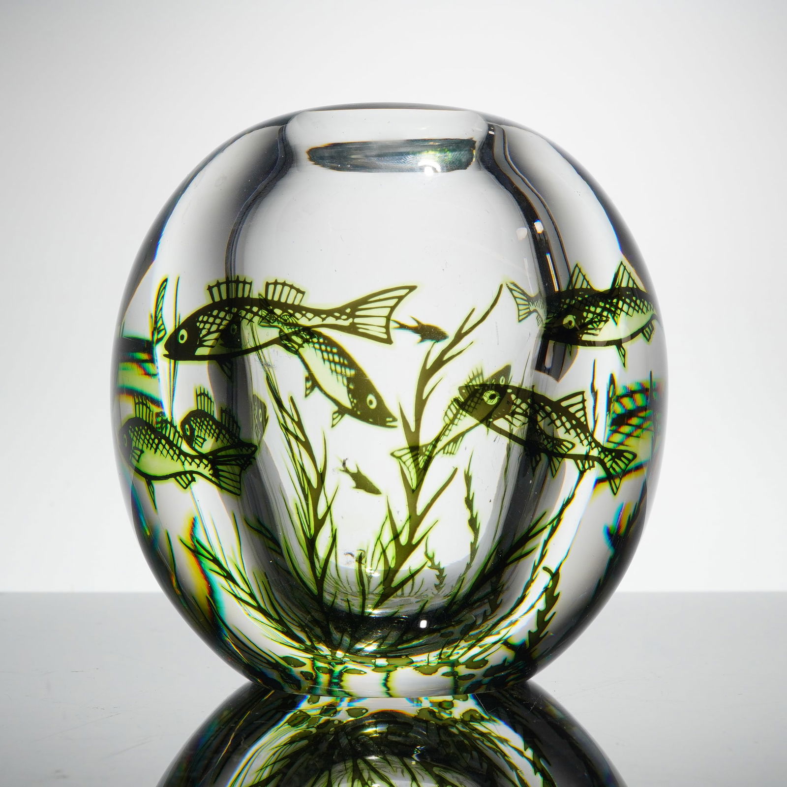 Edward Hald For Orrefors Graal Fish Crystal Vase: A single spherical art glass vessel executed in clear, colorless crystal, atributed to Edward Hald for Orrefors, Sweden. The piece utilizes the Graal technique, featuring an encapsulated aquatic scene