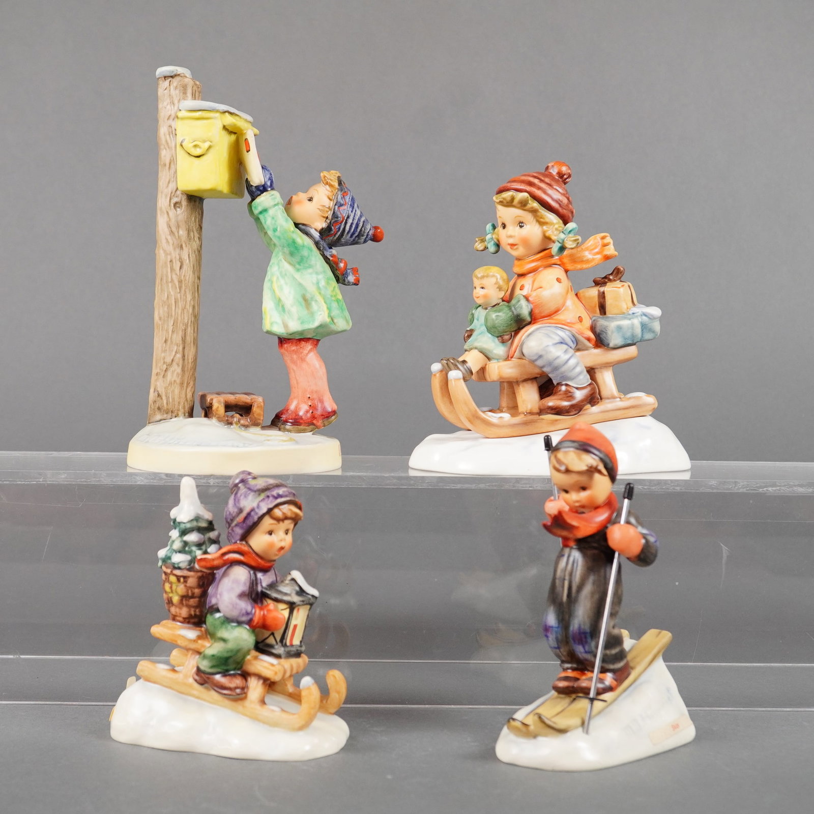 A Collection of Four Goebel M.I. Hummel Porcelain Figurines, Winter Theme (1 of 3)