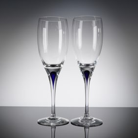 A Pair of Orrefors Intermezzo Blue Crystal Flutes