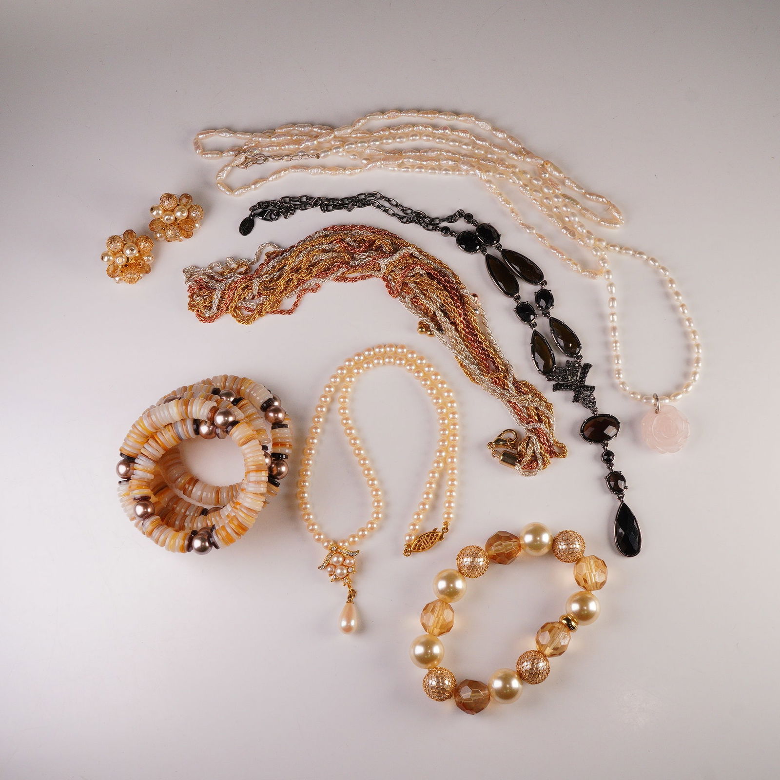 8pc Collection of Jewelry including Tommy Hilfiger Bracelet & Earring Set: Chic 8-piece costume jewelry collection featuring a mix of contemporary and vintage-inspired designs. The lot includes five necklaces - among them a faux pearl strand with rose quartz pendant, a multi