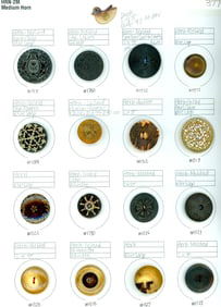 A card of assorted old horn buttons