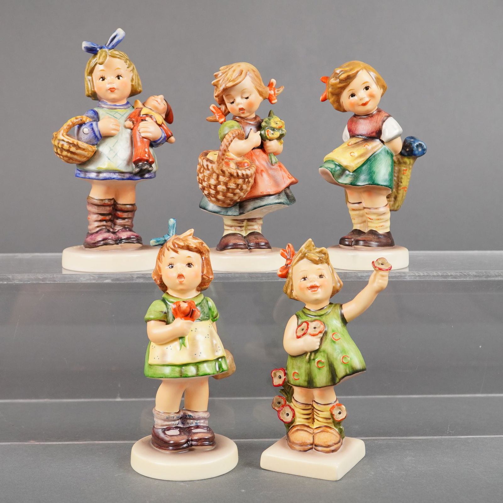A Collection of Five Goebel M.I. Hummel Ceramic Figurines (1 of 3)