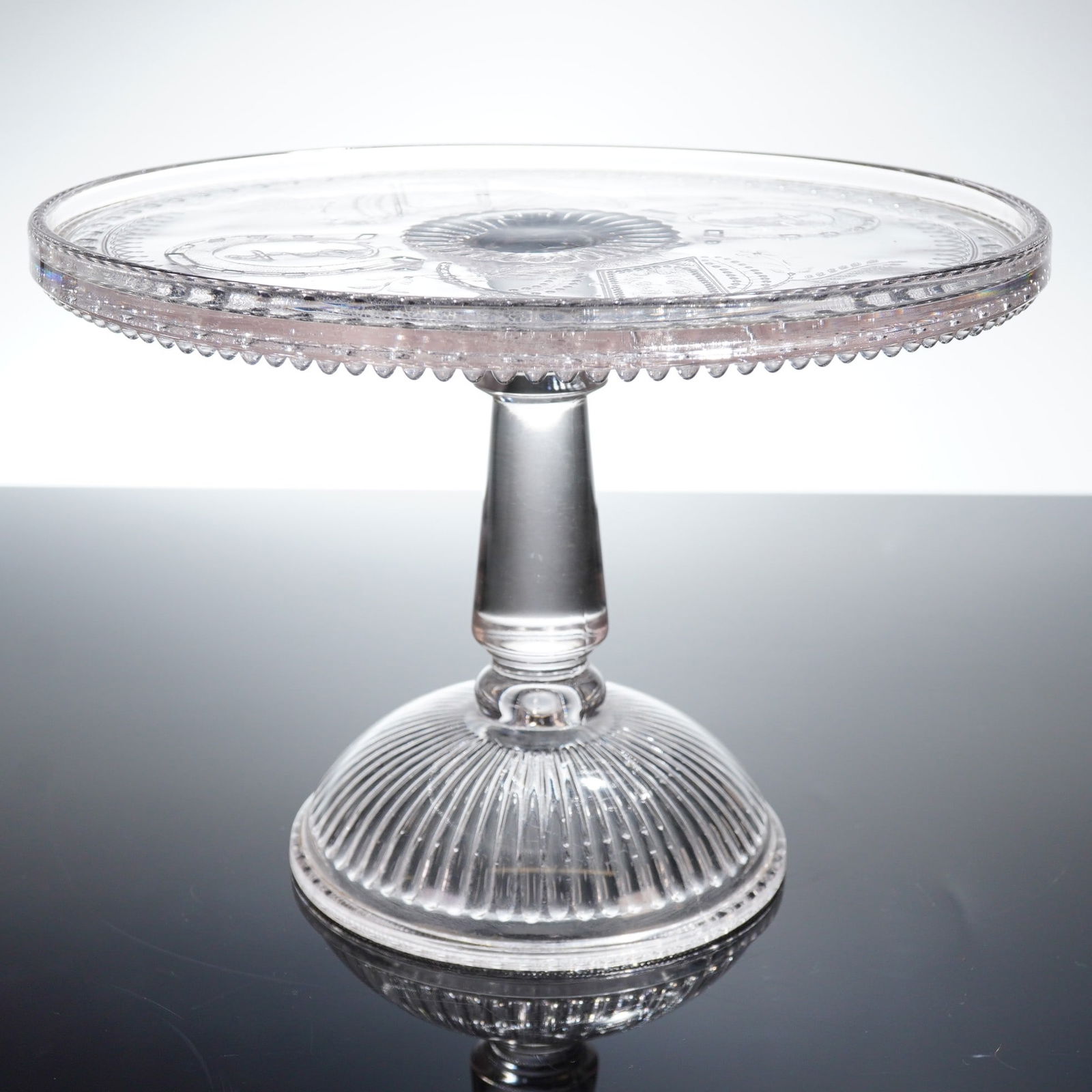 EAPG Adams & Co. Good Luck Horseshoe Prayer Rug Pattern Cake Stand: A single Early American Pattern Glass EAPG pedestal cake stand, attributed to Adams & Co. and dating to the late 19th century (circa 1880s-1890s). The pattern is widely known as Good Luck, Horseshoe,