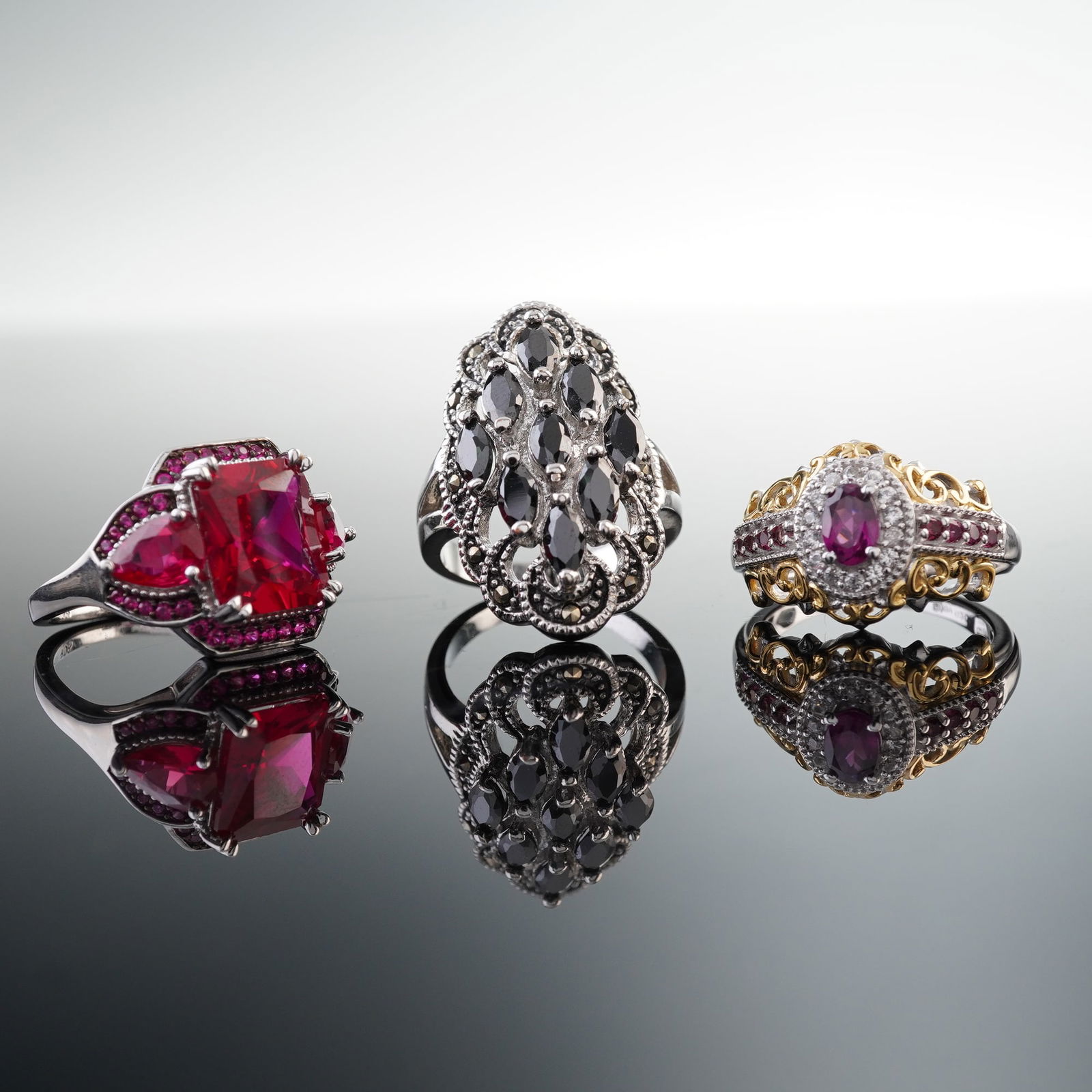 3pc Cocktail Ring Set, 2 Sterling Silver (925) Rings & 1 Costume: This 3-piece cocktail ring set features bold designs with a dazzling array of mixed stones. Two of the rings are crafted from sterling silver, marked 925, and are adorned with vibrant stones in pink